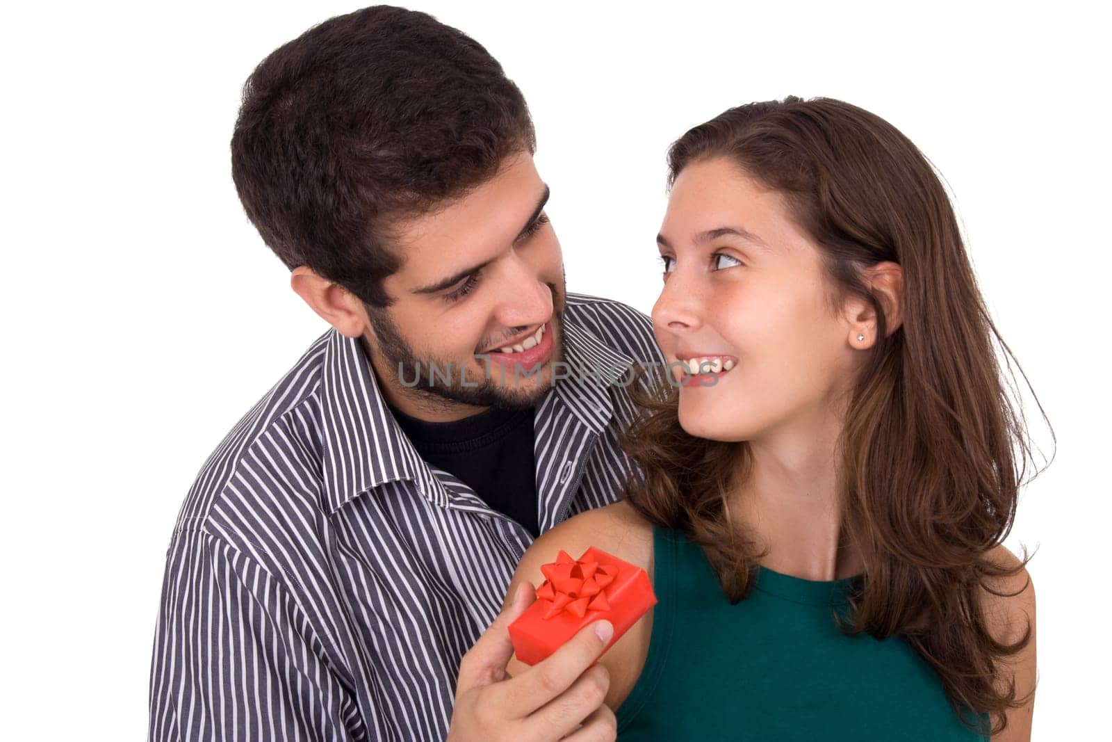Young couple. Man giving a present to a beautiful young woman.