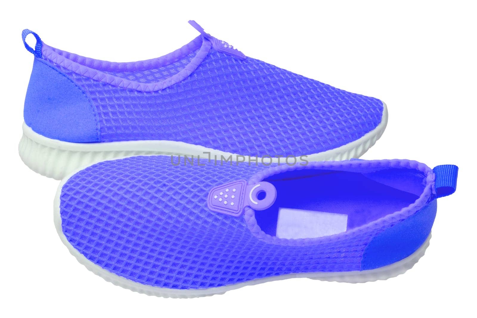 Blue sneaker isolated. Close-up of women's trendy athletic shoes or sport sneakers isolated on a white background. Modern footwear design for workout. Macro.