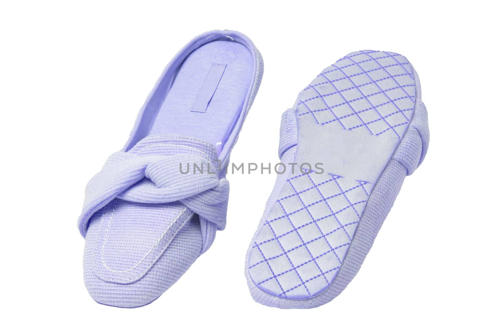 Slippers isolated. Close-up of a pair of female blue warm and soft cosy terry house slippers isolated on white background.  Womans shoes. Macro.