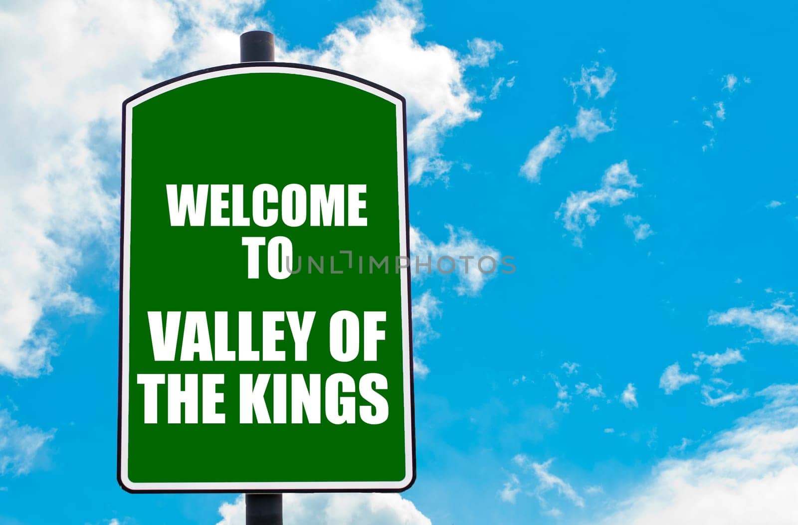 Green road sign with greeting message WELCOME TO VALLEY OF THE KINGS copy space. Travel destination concept  image