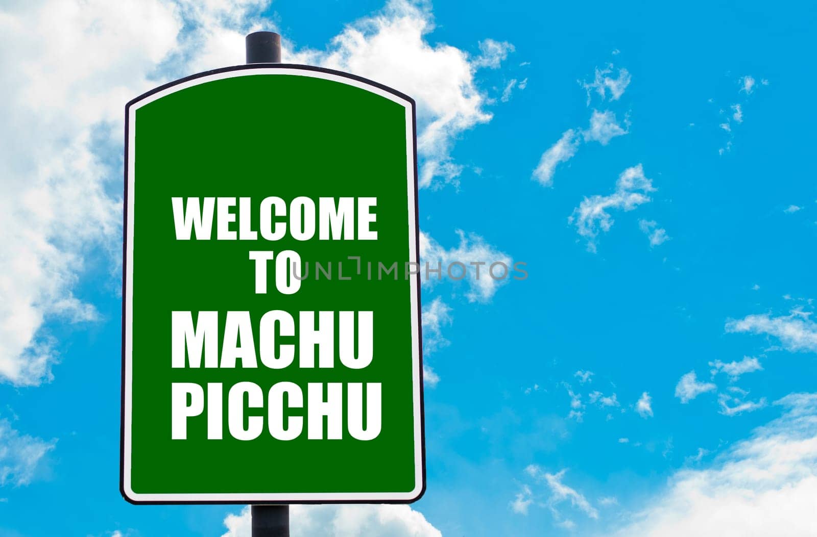 Green road sign with greeting message WELCOME TO MACHU PICCHU, PERU isolated over clear blue sky background with available copy space. Travel destination concept  image