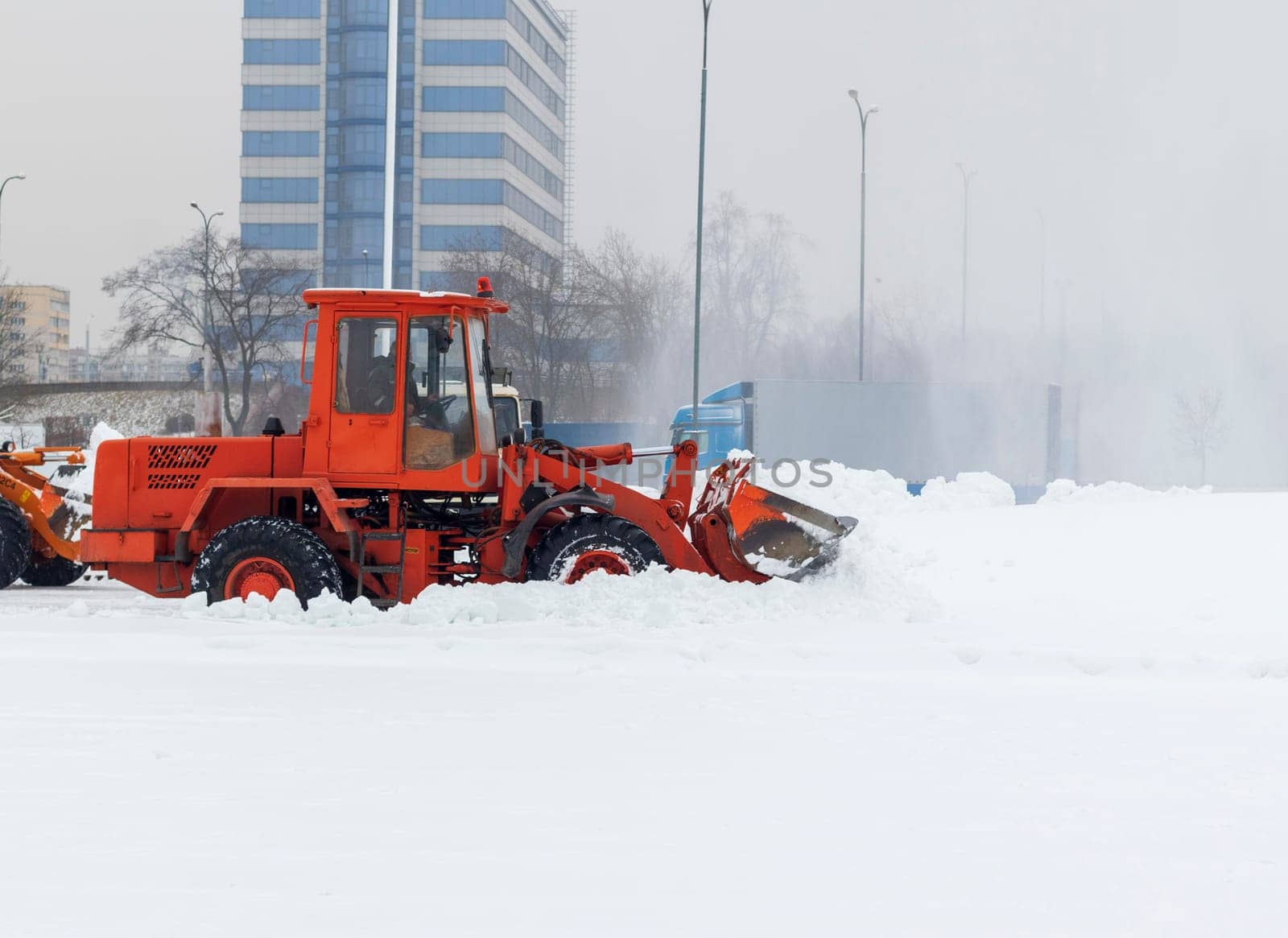 Heavy machinery cleaning the snow after heavy snowfall