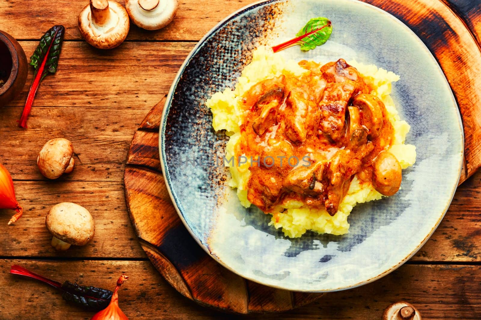Beef meat stew in sauce with mashed potatoes. Space for text, recipe place