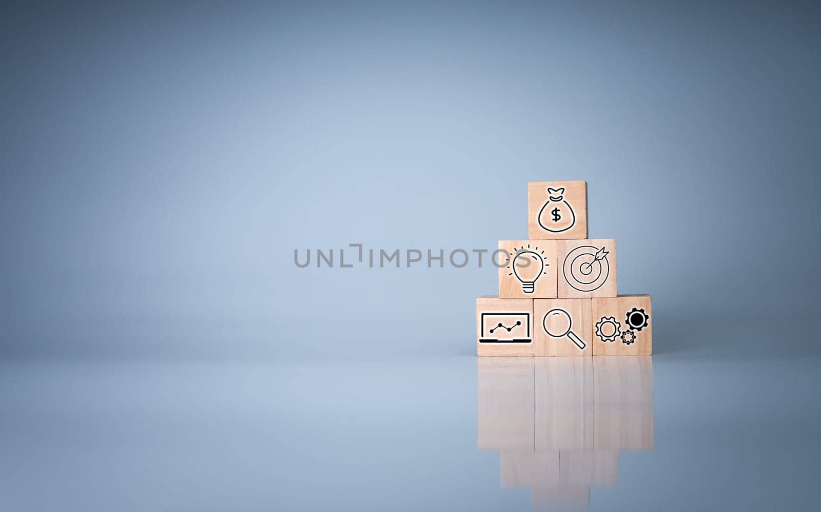 Wood cube block stacking with icon.Concept of business strategy and goal action plan.