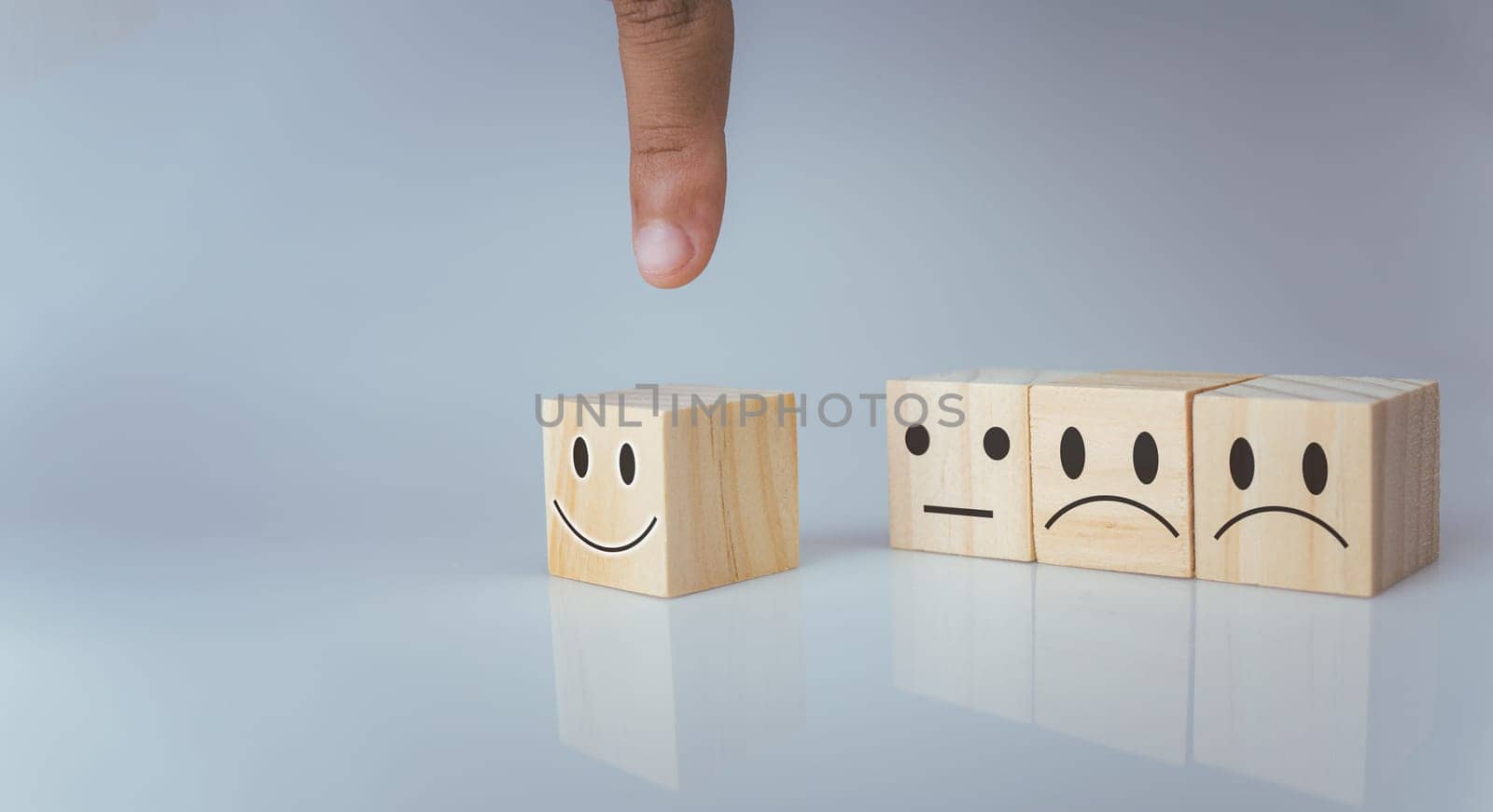 Hand choosing happy smile icon. represents feedback rating and positive customer review, Satisfaction Concept, satisfaction survey ,mental health assessment, world mental health day, think positive concept