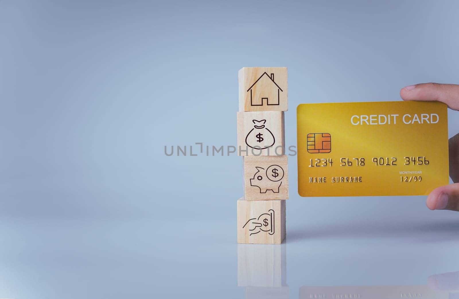 Concept of selling a house. A hand is holding credit card on a white background. Real estate agent offer house, property insurance and security, affordable housing concepts, home insurance broker agent, salesman person.