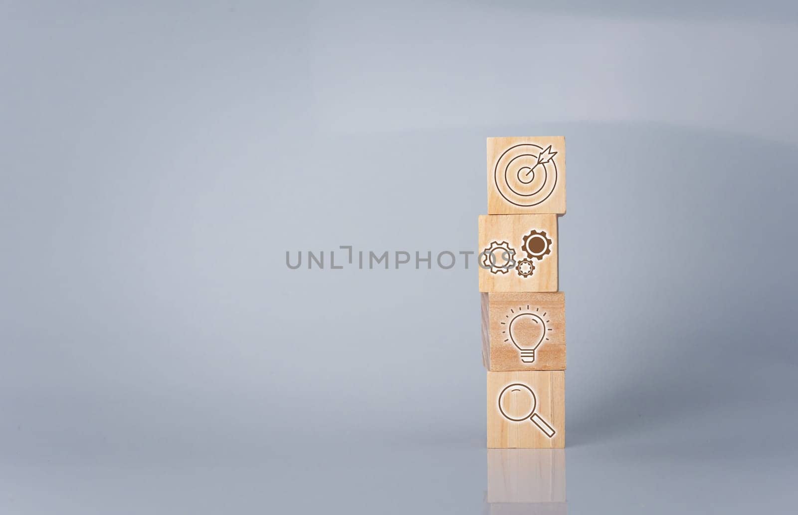 Wood cube block stacking with icon.Concept of business strategy and goal action plan.