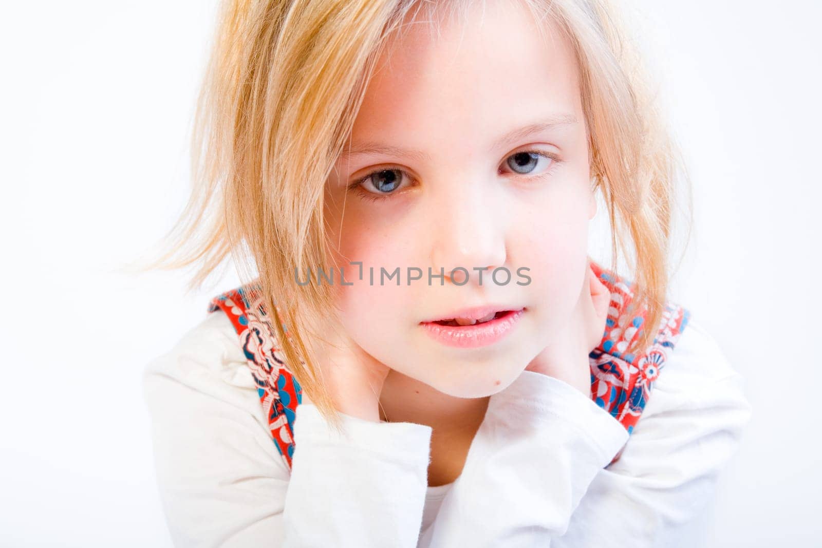 Studio portrait of a blond child