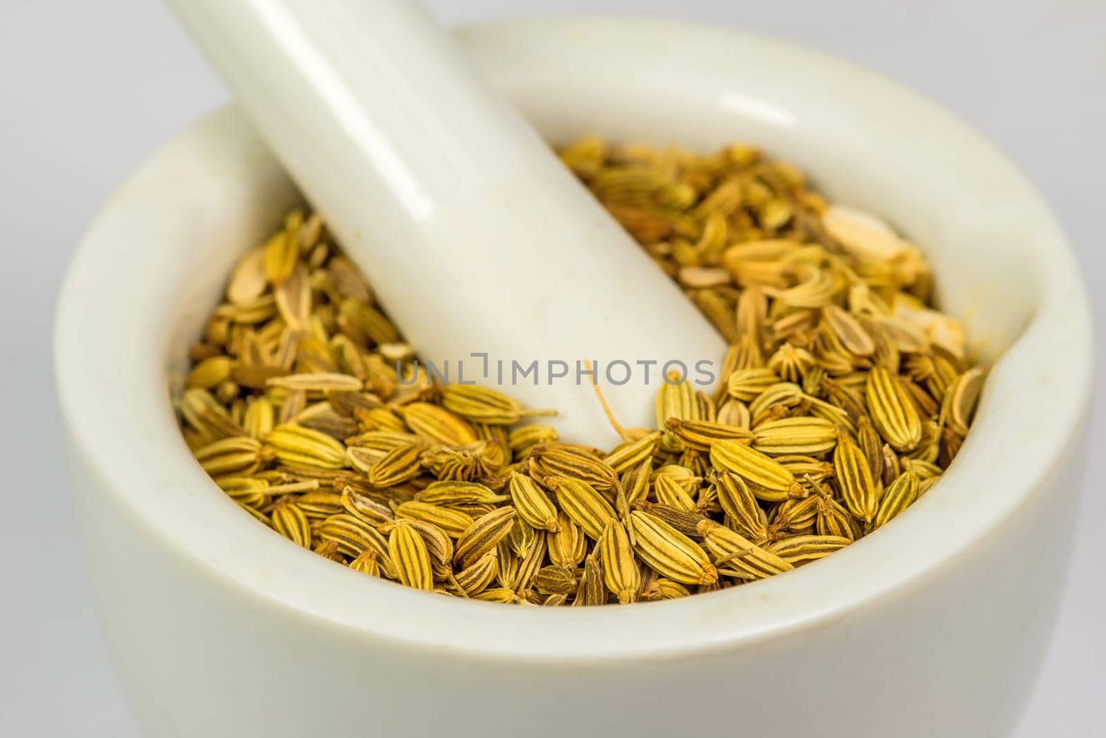 Fennel seeds, medicinal drug and spice  in a mortar