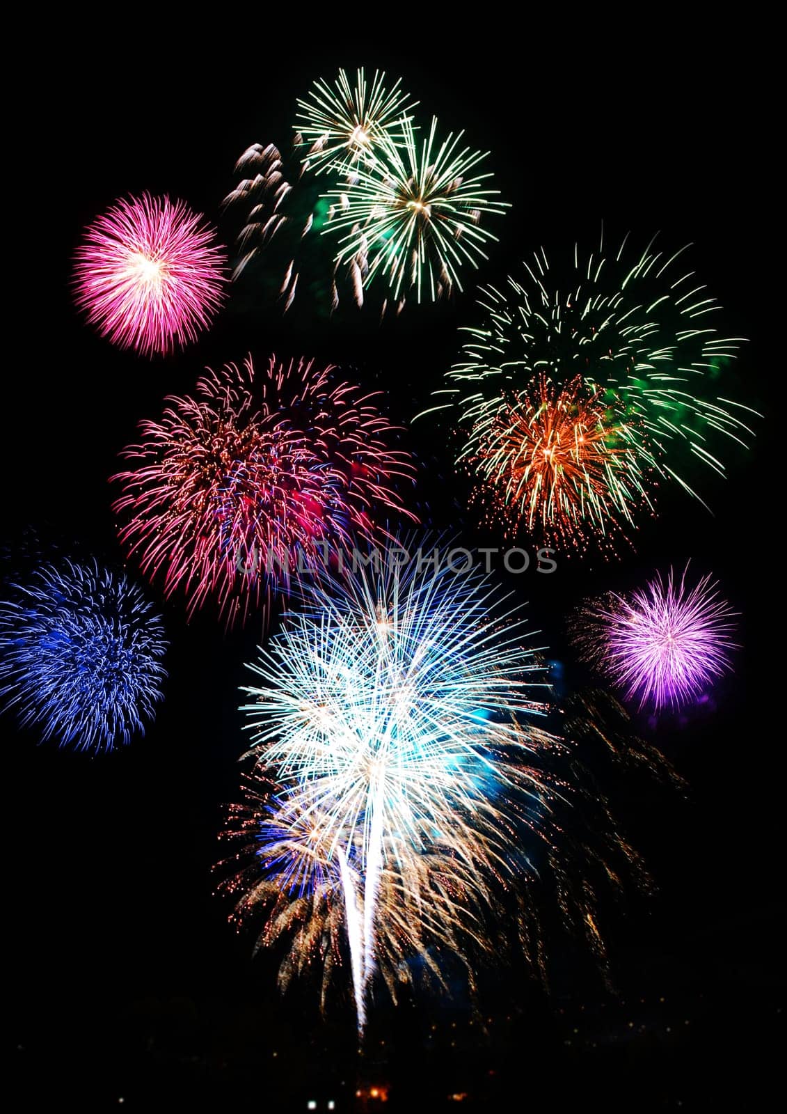 Fireworks lighting up a dark sky.