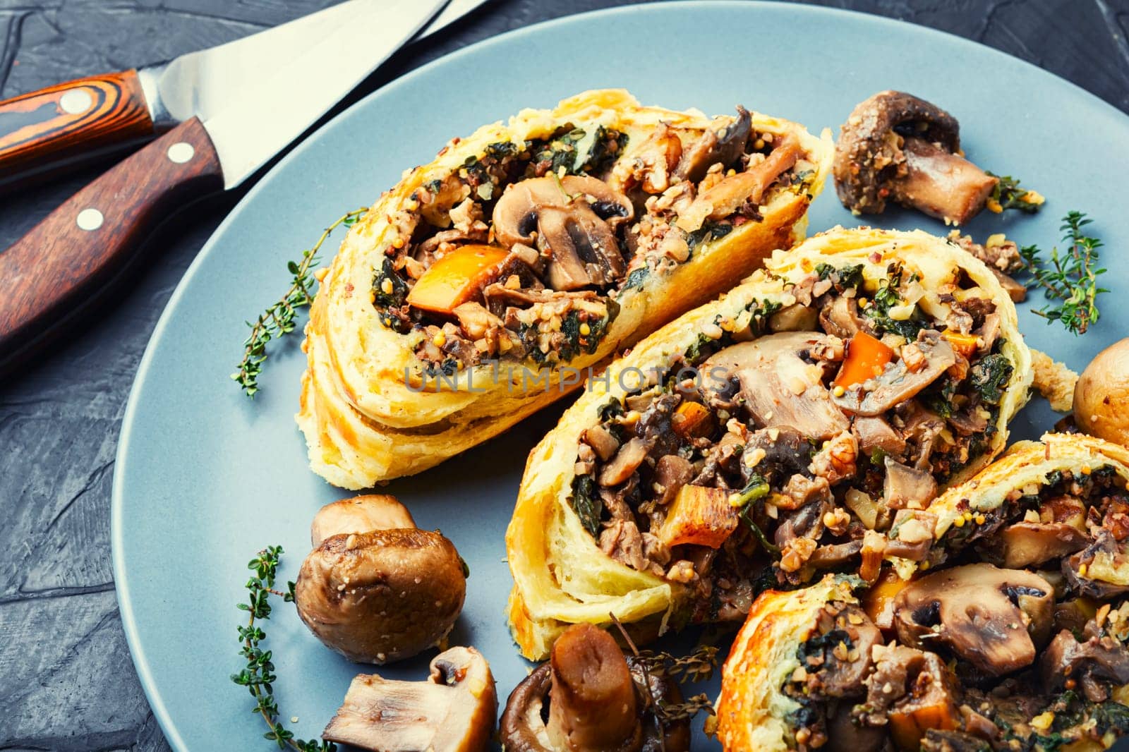Piece closed homemade savory tart pie with mushrooms and persimmon