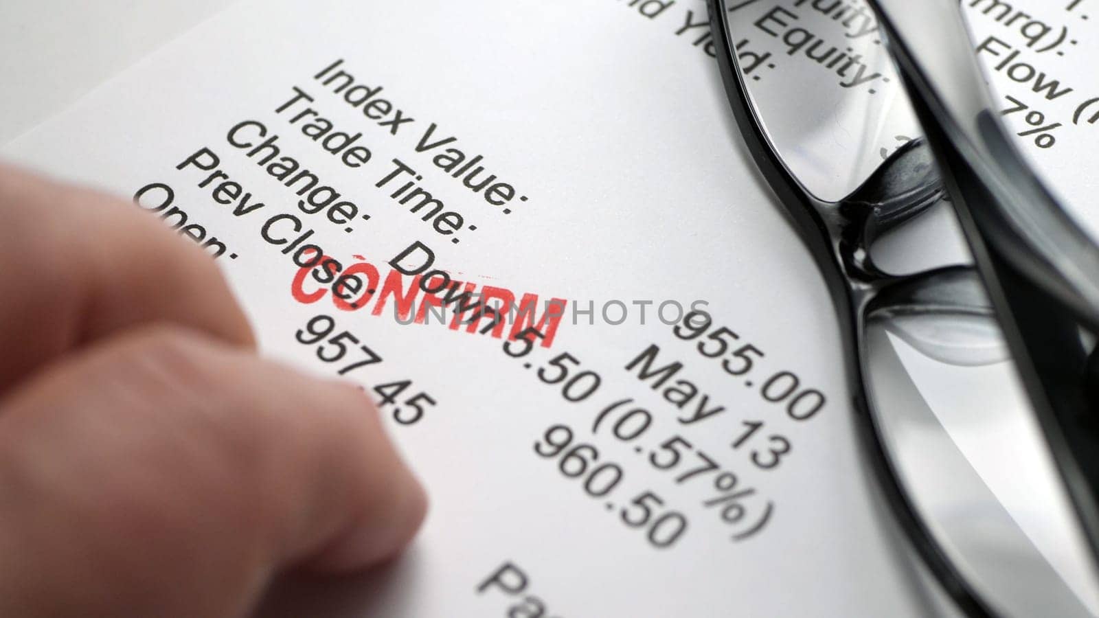 Finger tapping on financial report