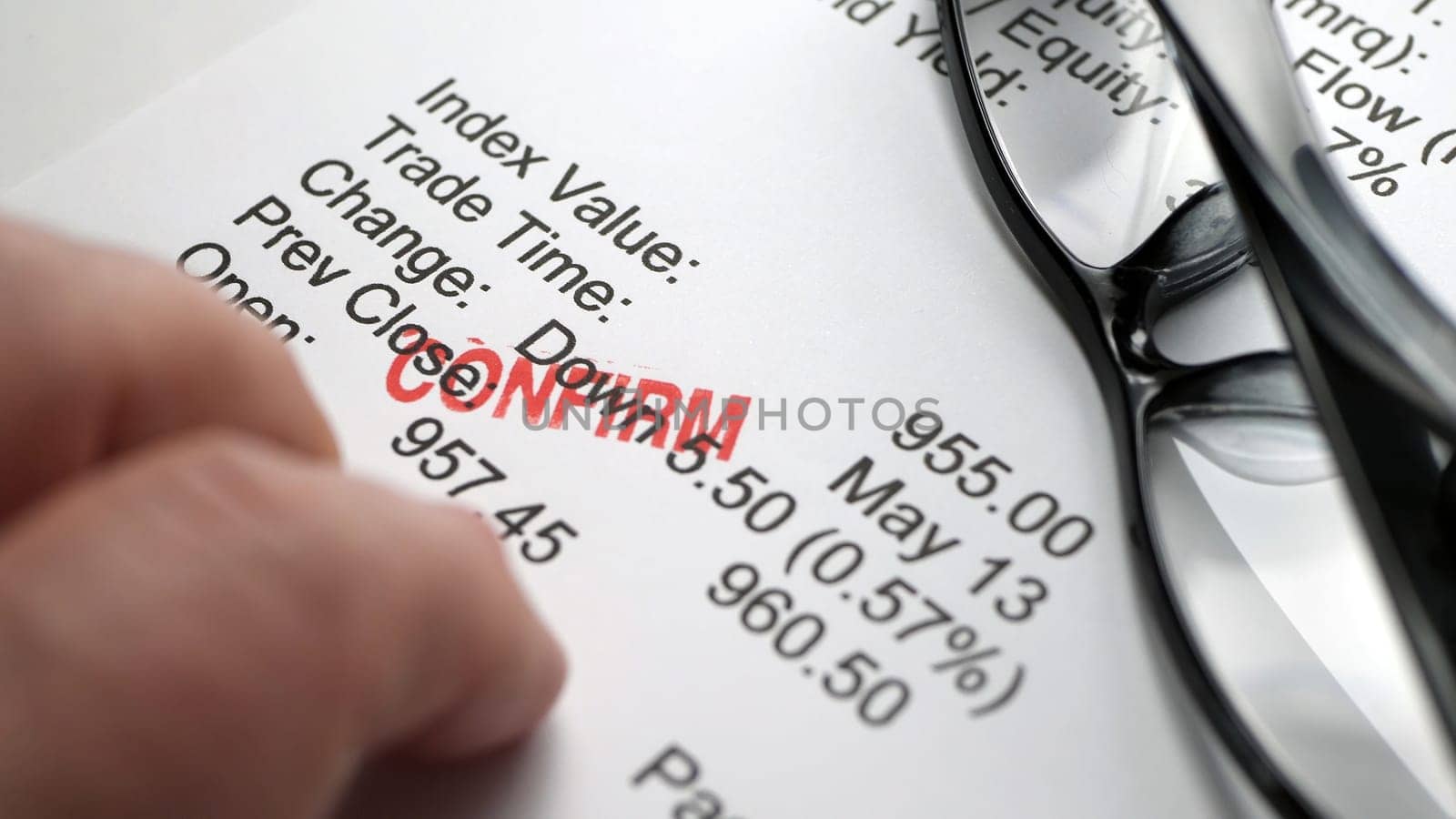Finger tapping on financial report,Finger tapping on financial report