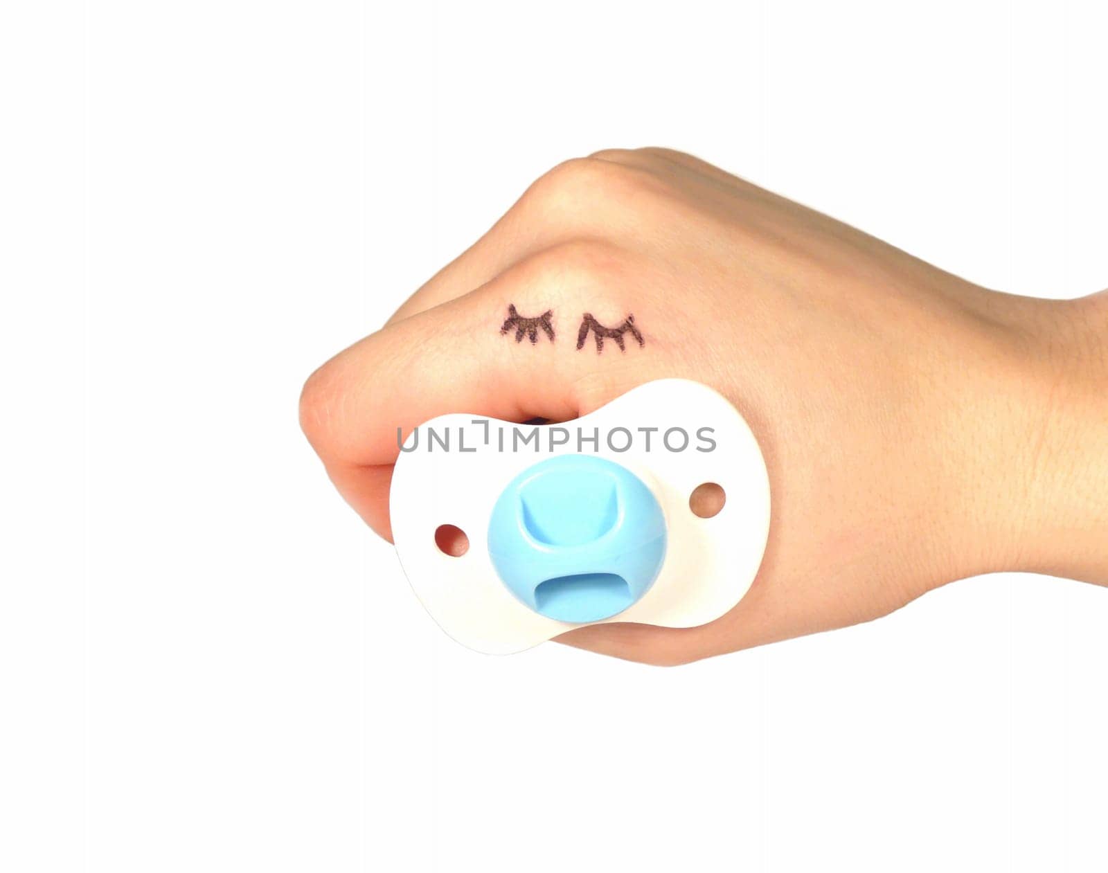 hand puppet dressed up as a sleeping baby boy over white