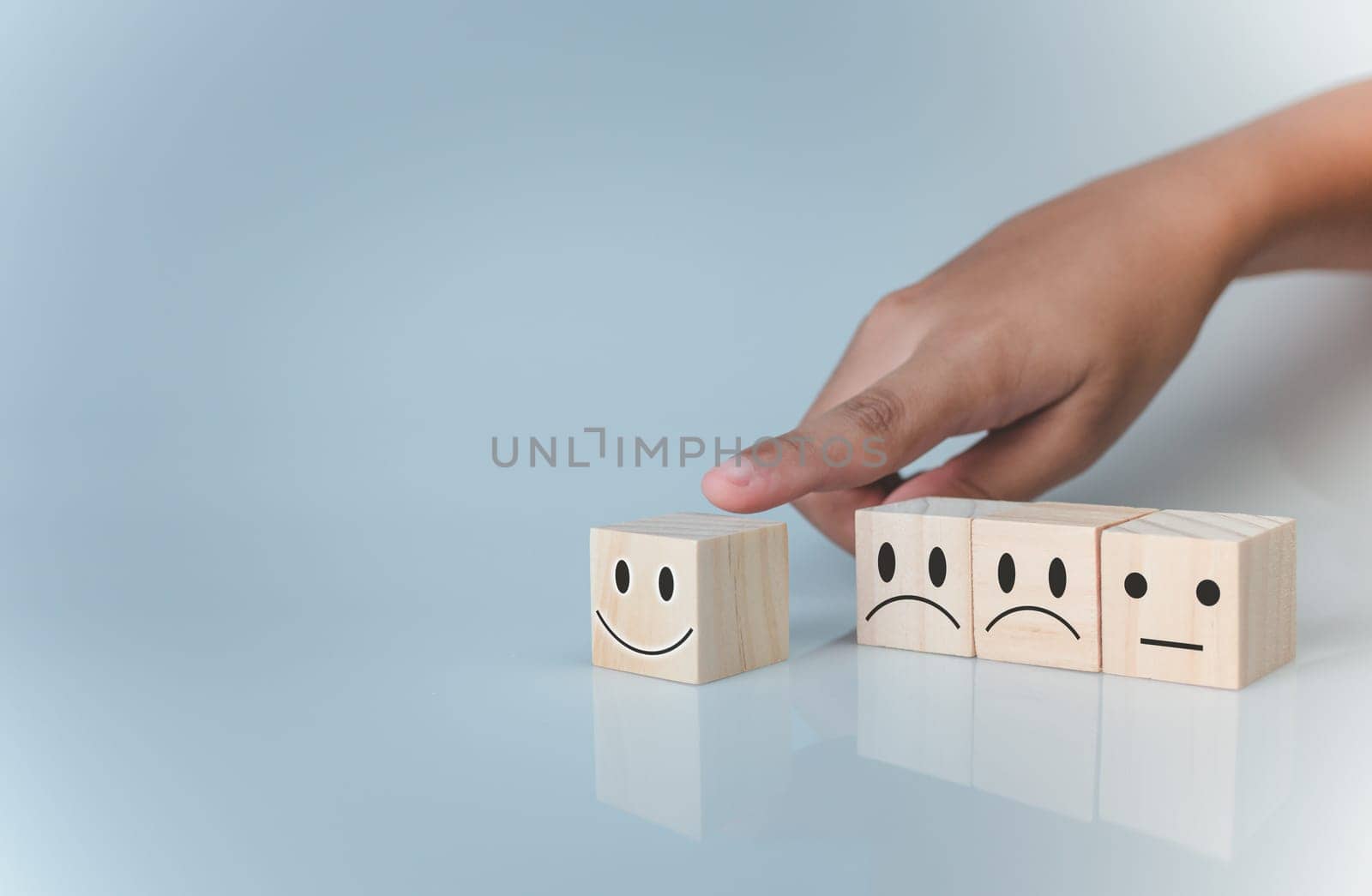 Hand choosing happy smile icon. represents feedback rating and positive customer review, Satisfaction Concept, satisfaction survey ,mental health assessment, world mental health day, think positive concept