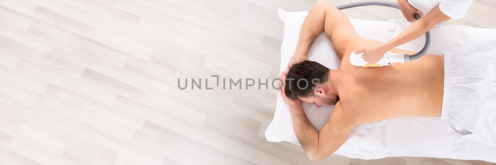 Hair Removal Cosmetology Procedure From A Therapist At Cosmetic Beauty Spa Clinic