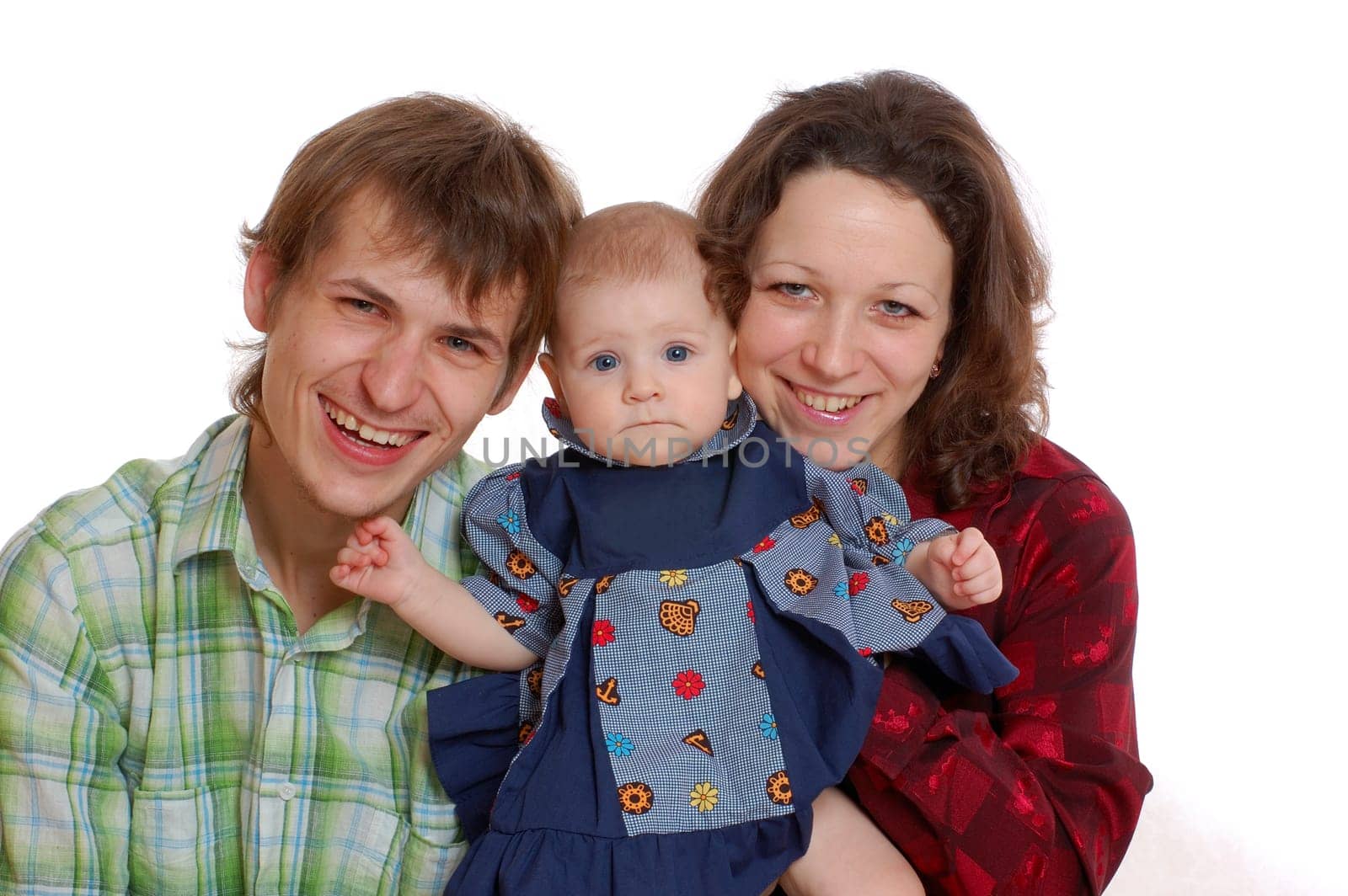 happy family smiling and holding their  baby