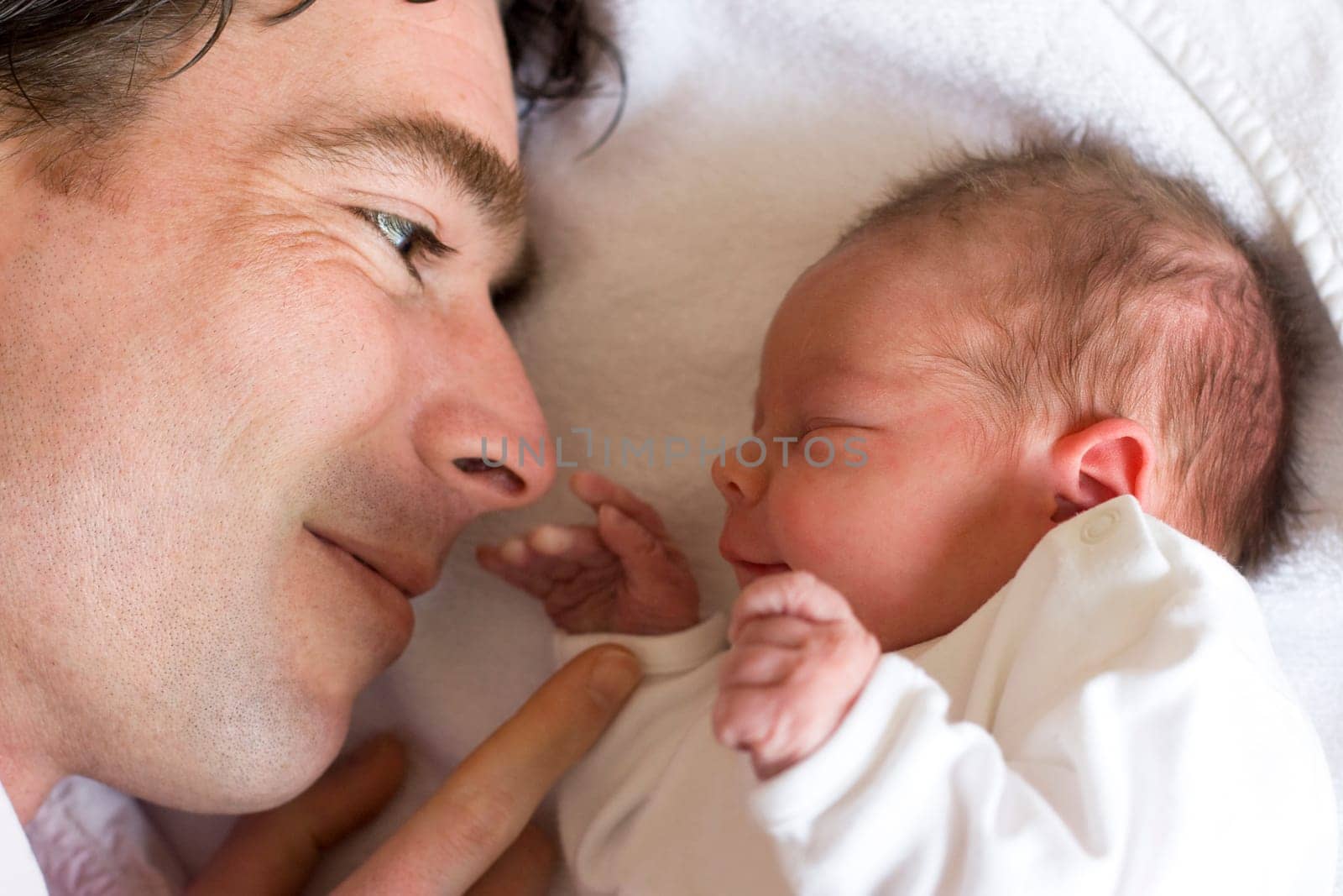 young father with his newborn daughter, only a couple of hours old