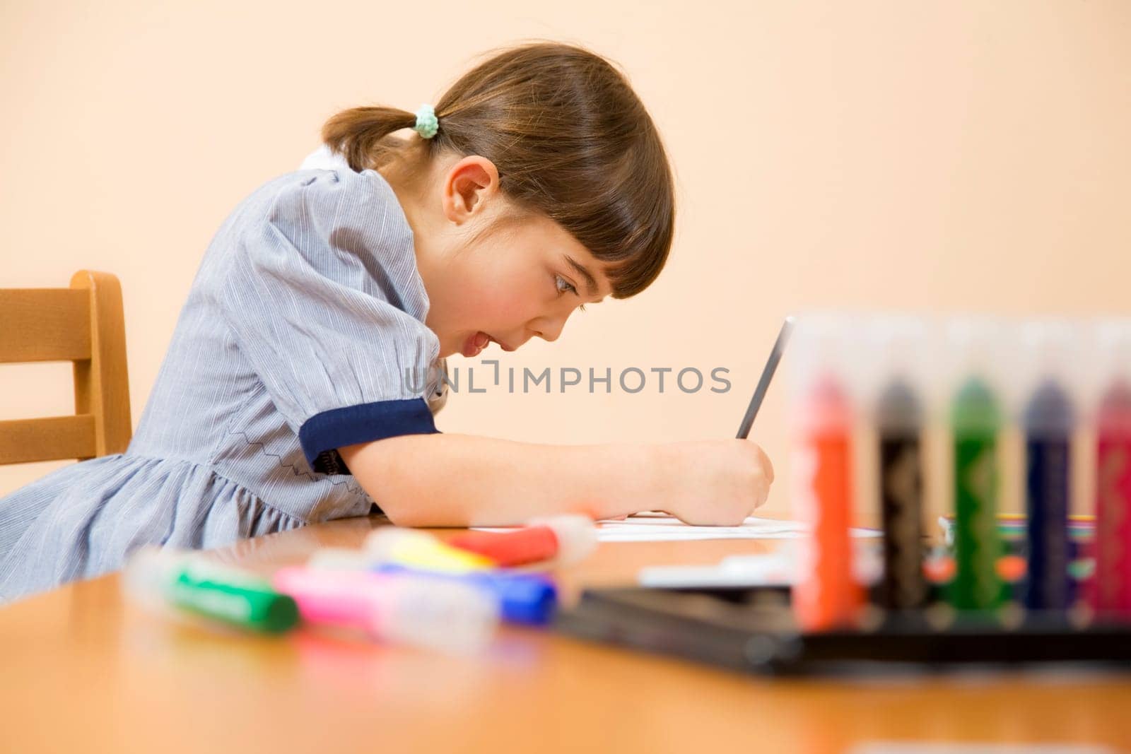 little girl playing with colors