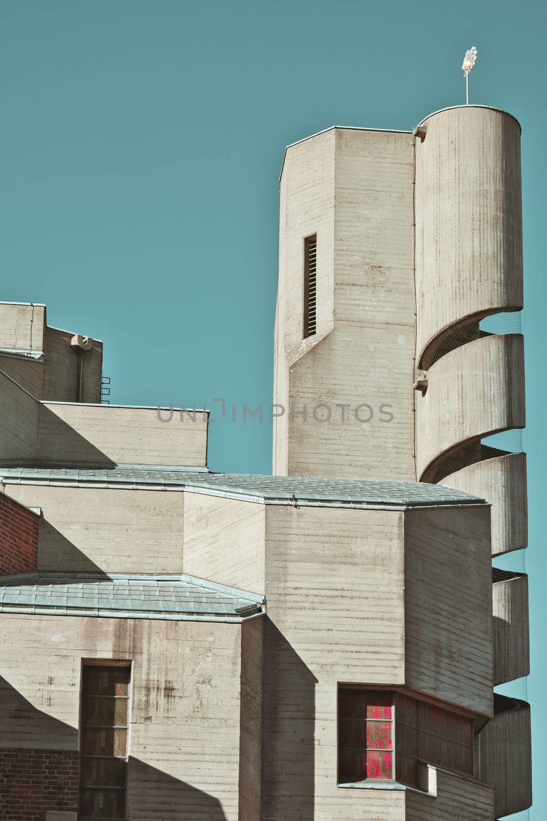 Christi Auferstehung church tower with spiral staircase on blue sky background in Cologne, Germany