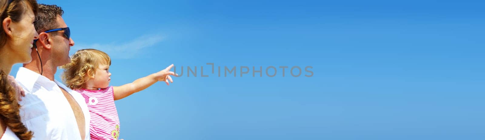 view of young family hanging out in summer environment. Banner, lots of copy space