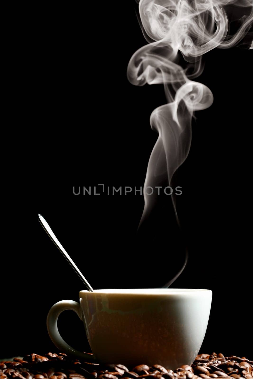 coffee beans and white hot cup of drink