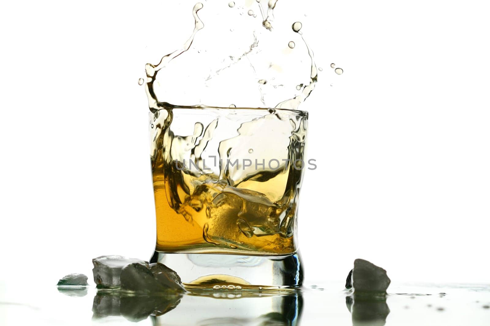 whisky splash alcohol drops isolated on white