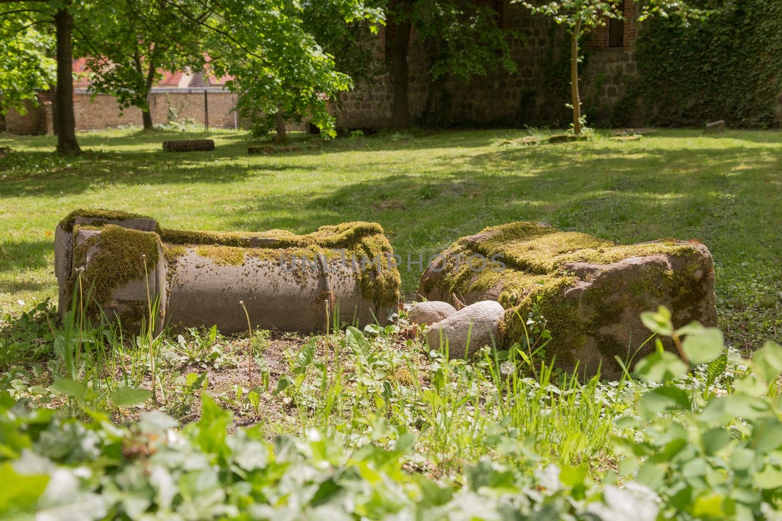 Two overturned columns on a churchyard