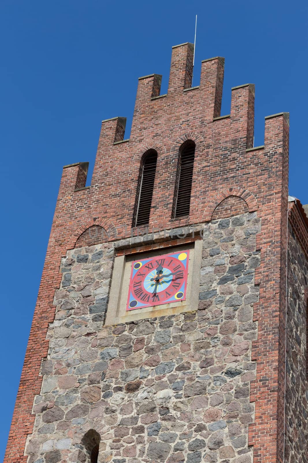 Tower of a church with a large dial