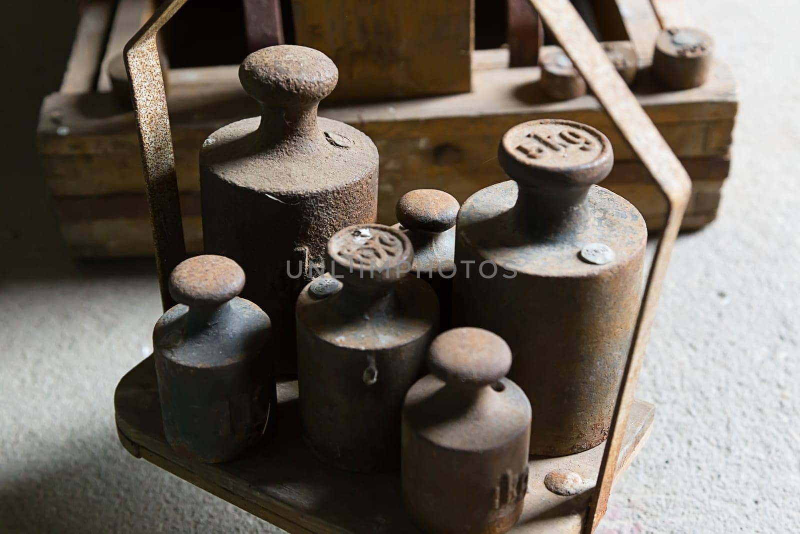 Old,rusted weights on a scale