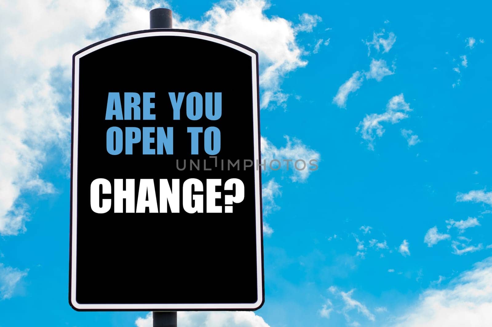 ARE YOU OPEN TO CHANGE motivational quote written on road sign isolated over clear blue sky background with available copy space. Concept  image