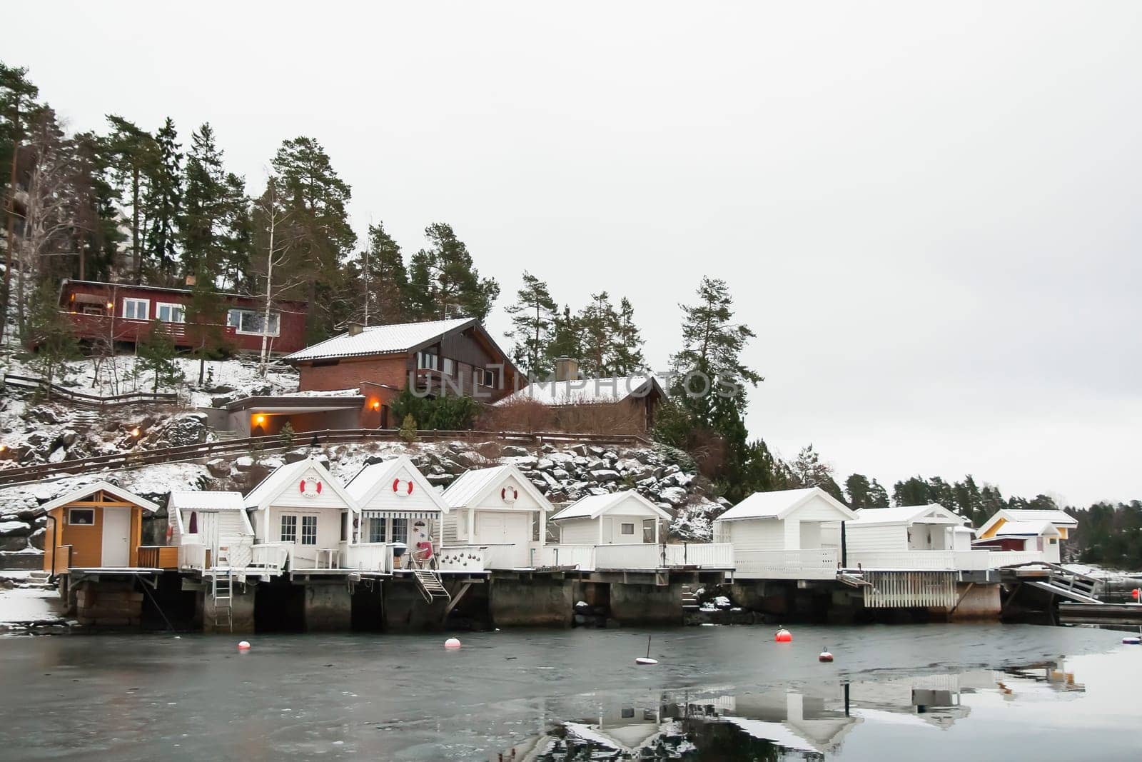 View at sunrise of a bathhouse norvegian snow