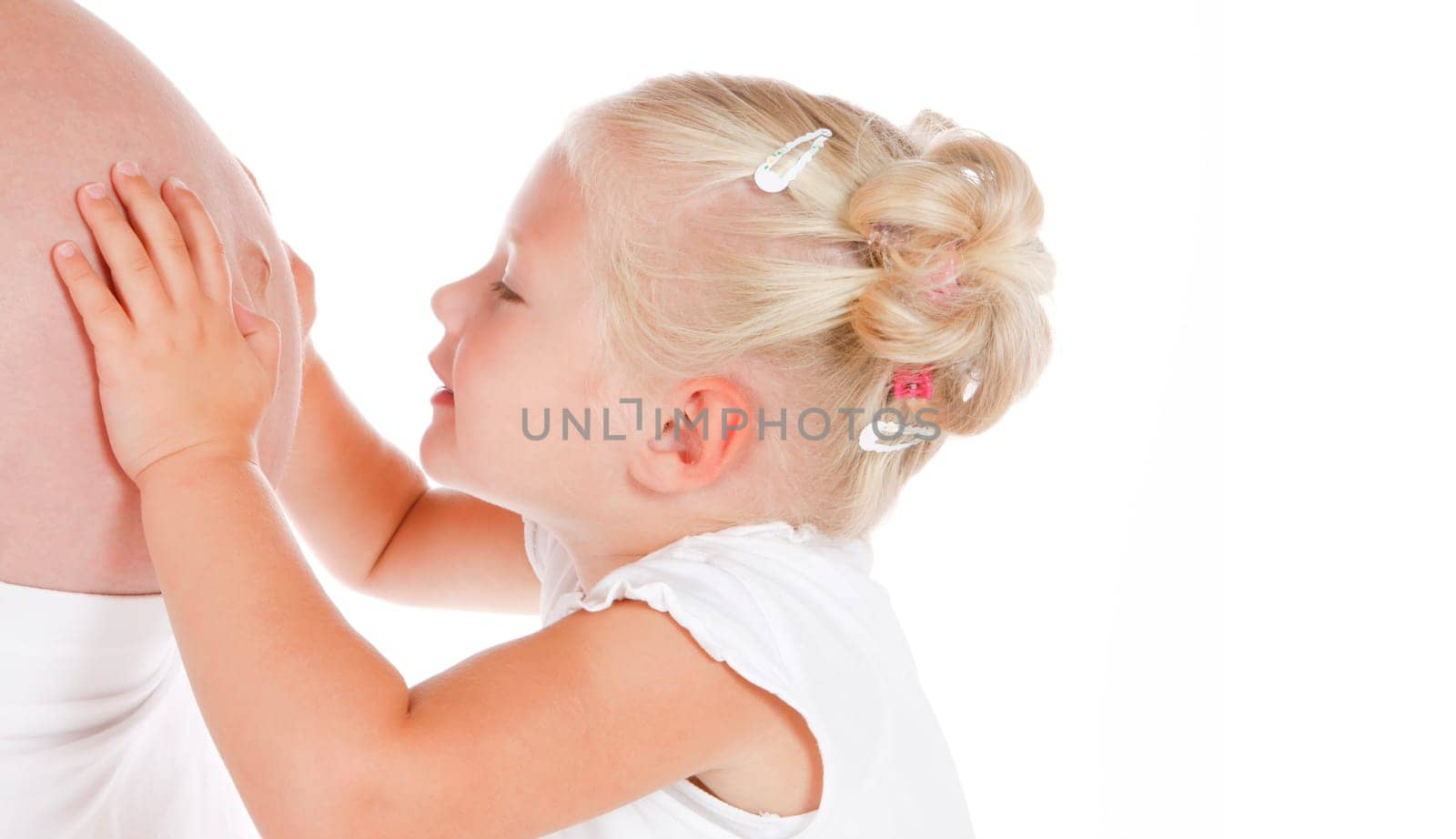 cute little girl talking to her new baby-brother