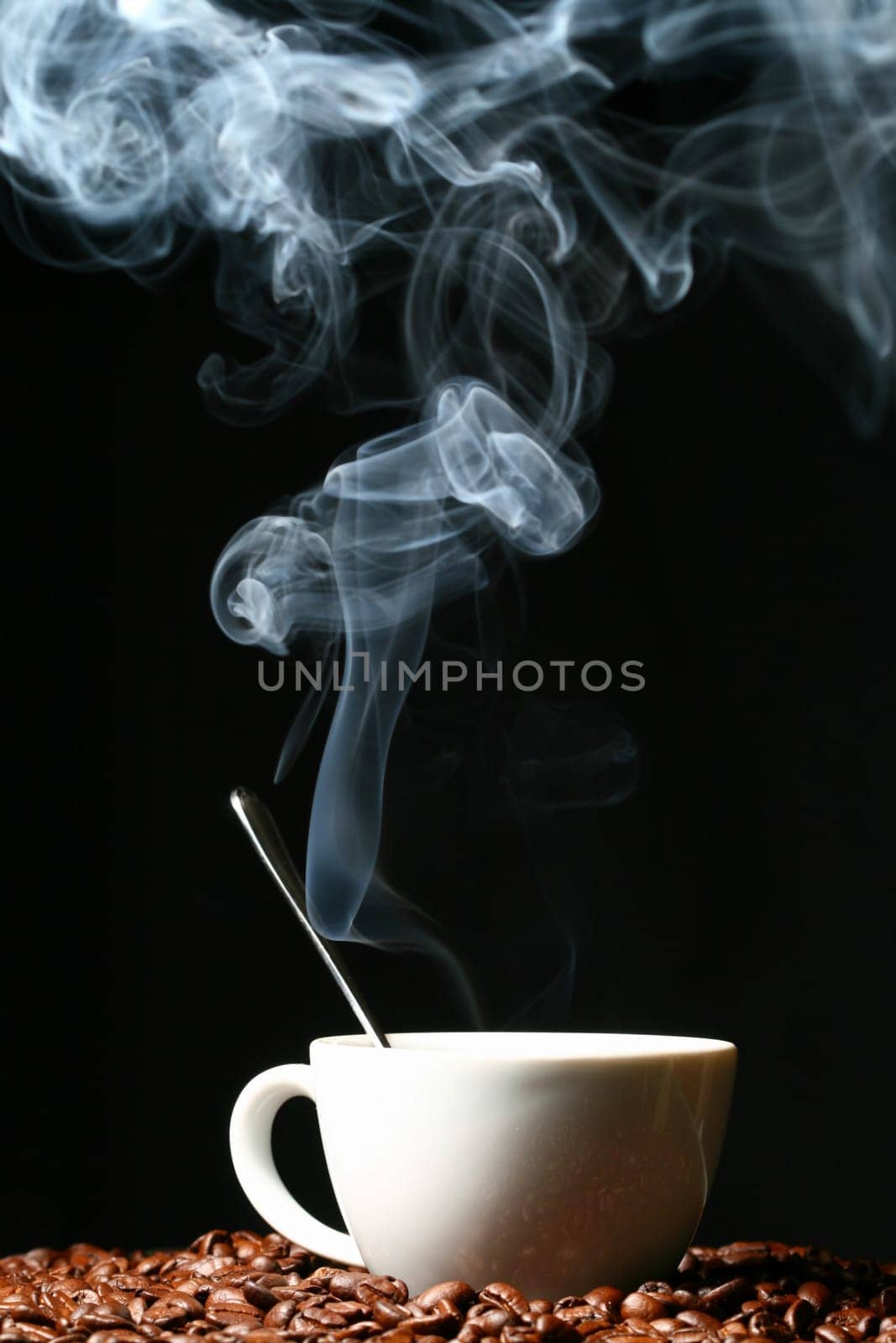 coffee beans and white hot cup of drink