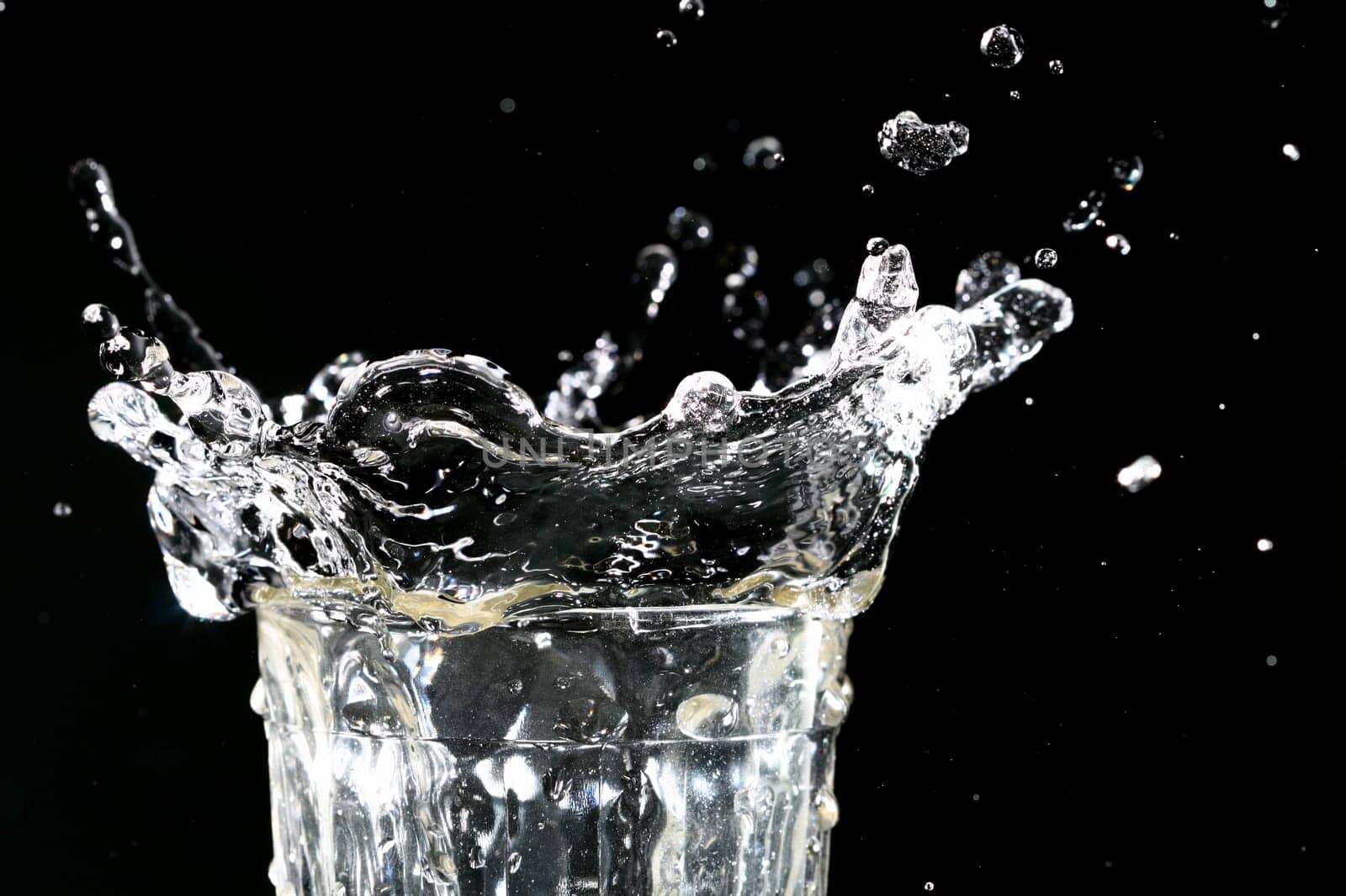 splash in glass on dark background