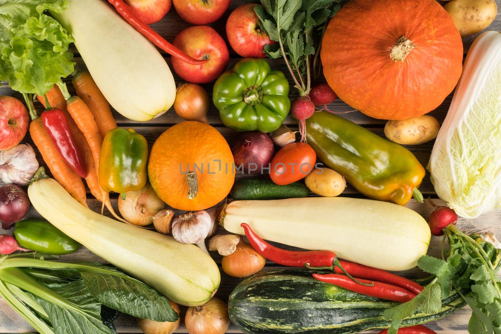 Multi composition of fresh farm vegetables and fruits, top view. Table full of organic ripe seasonal harvest. Nitrate free food or healthy diet concept. Balanced nutrition. Cooking ingredients.