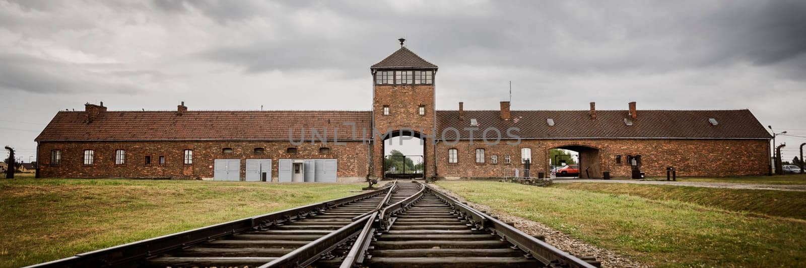 Railroad track to main gate of Auschwitz former German concentration and extermination camp in Poland