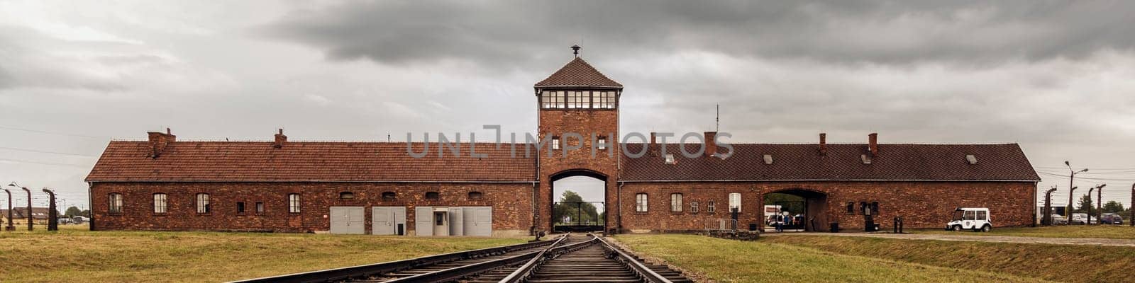 Railroad track to main gate of Auschwitz former German concentration and extermination camp in Poland