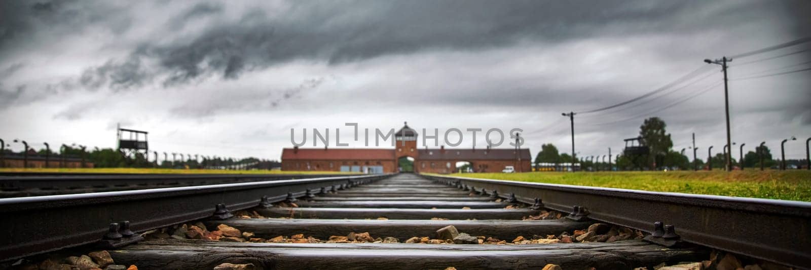 Railroad track to main gate of Auschwitz former German concentration and extermination camp in Poland