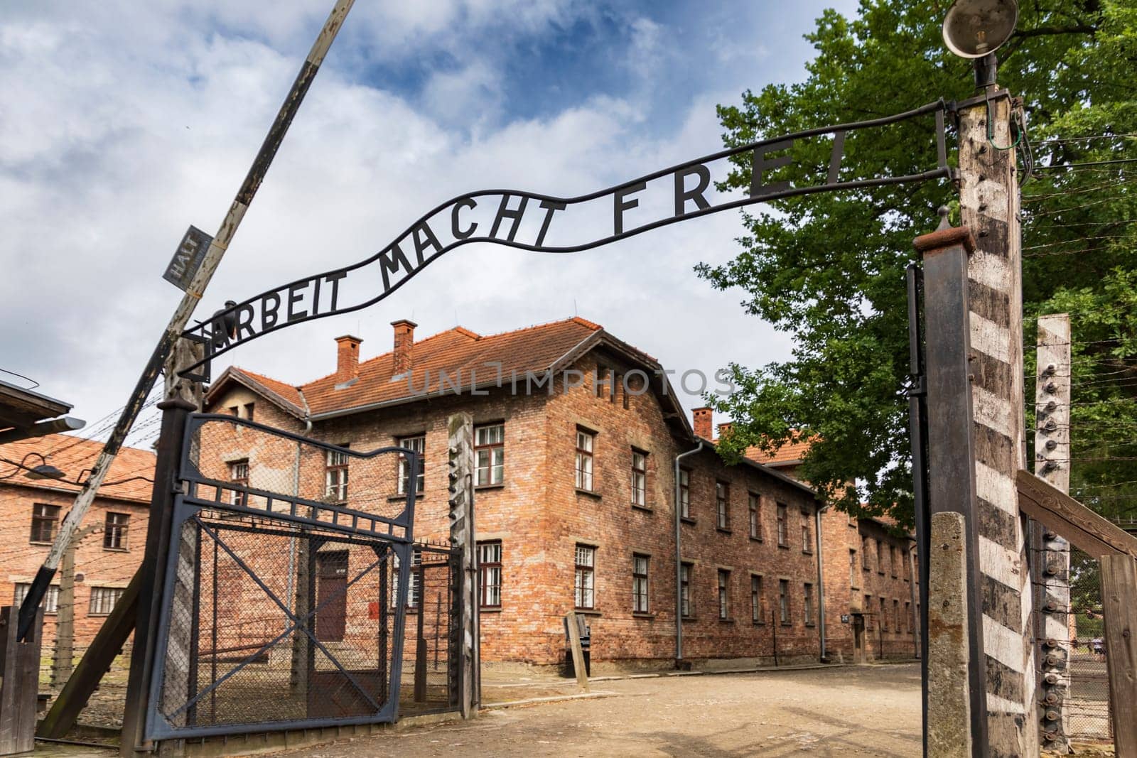 Entrance gate to former German Nazi concentration and extermination camp in Auschwitz in Poland