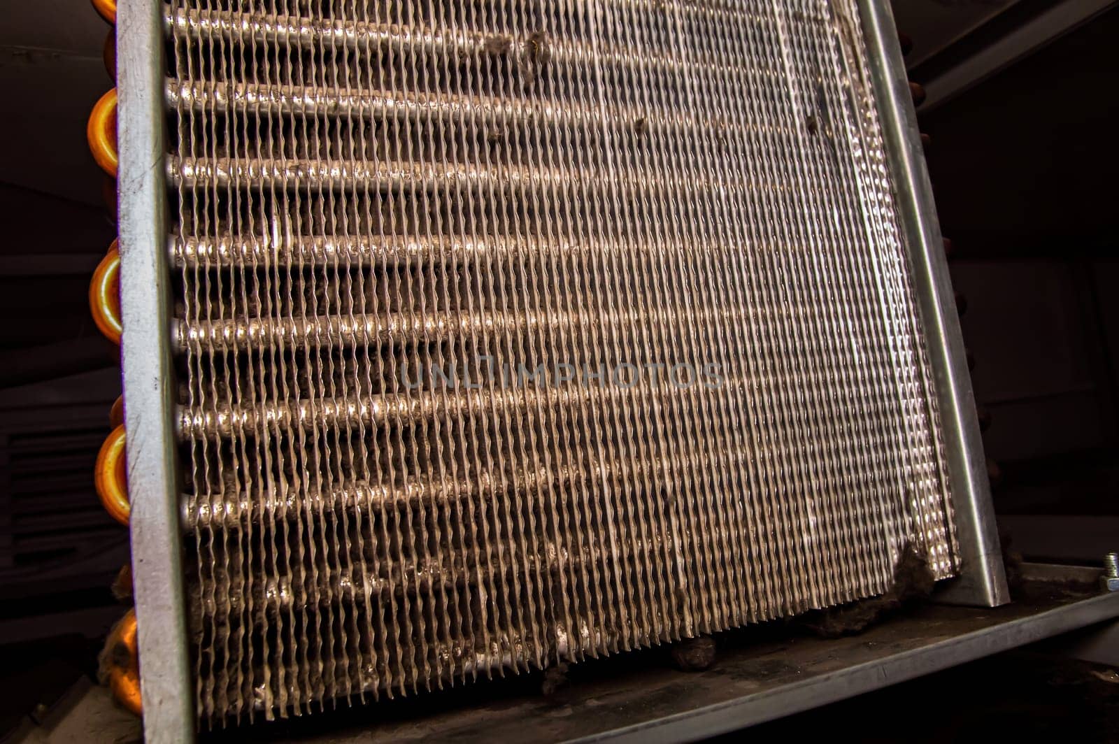 Aluminum grid for the copper condenser of the refrigeration unit. Refrigerator repair. Refrigeration piping. Cooling radiator. Service maintenance. Repair of air conditioners. Industry.