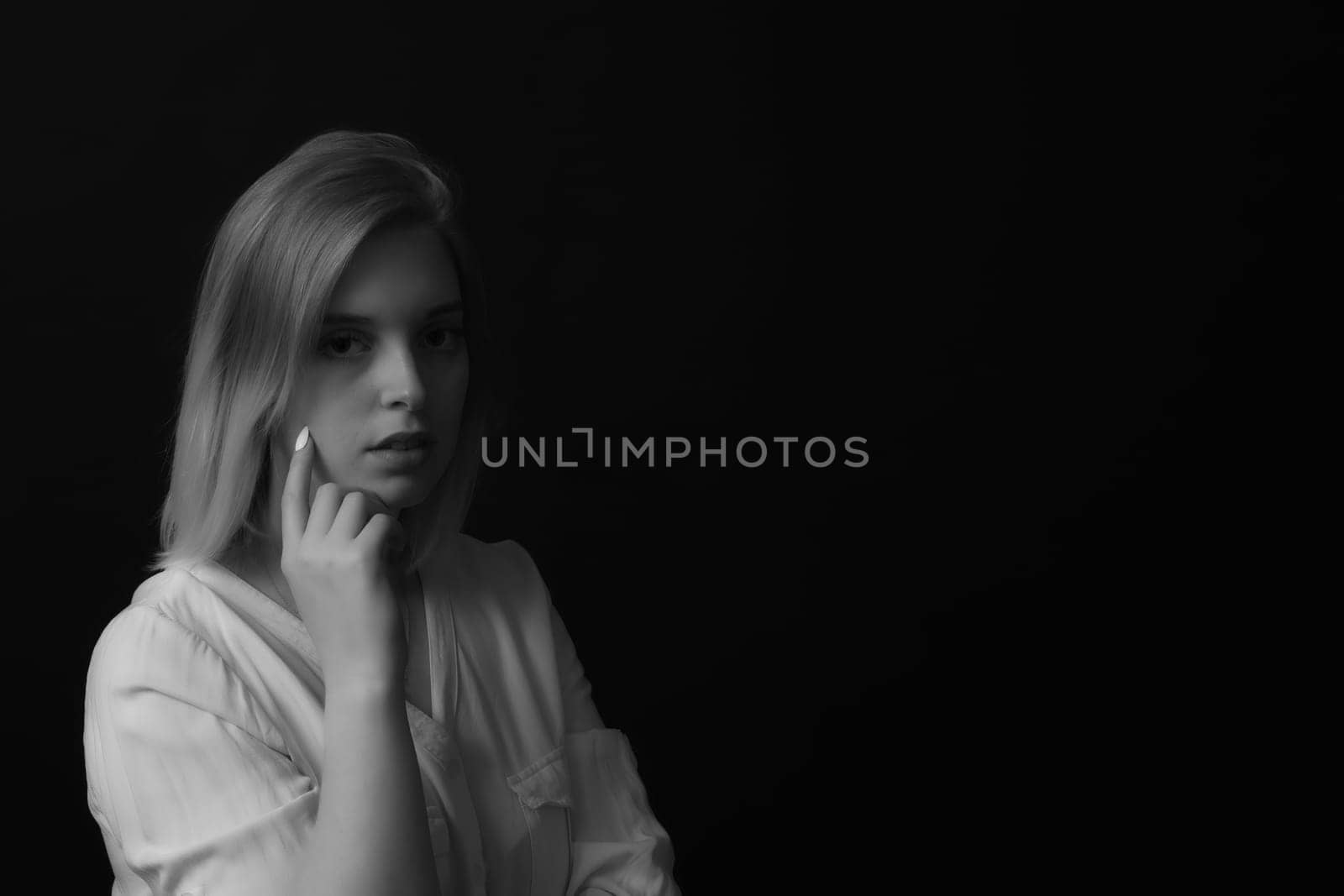 Black and white portrait of sad .girl. Horizontally.