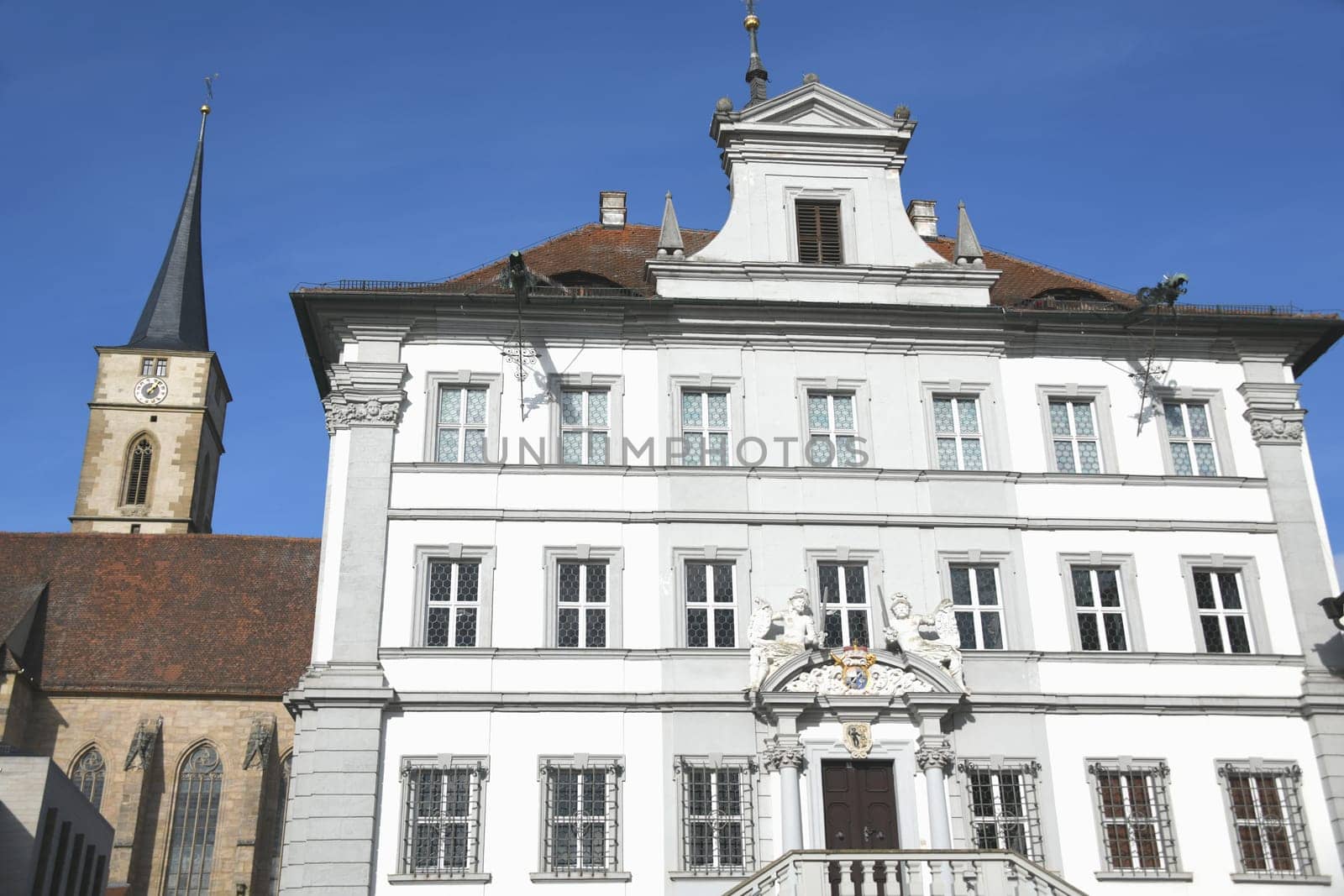 The town of Iphofen is located in the Lower Franconian district of Kitzingen,in Bavaria,Germany.  The city is known for its wine growing and historic old town. The town hall on the market square.