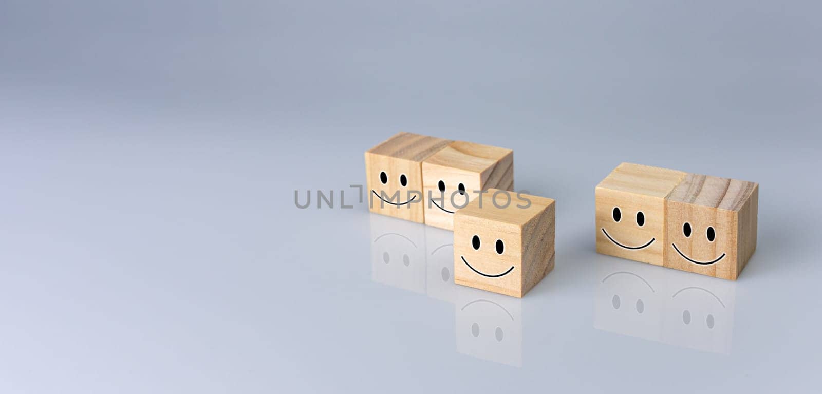Smiles on the cube. It represents positive ratings, feedback and customer reviews. Satisfaction Concept, Satisfaction Survey, Mental Health Assessment, Positive Thinking Concept.