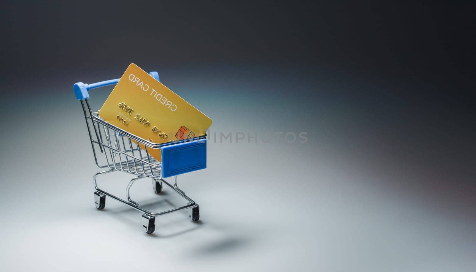 Shopping car and mockup credit card  on light and shadow background. shopping online concept.