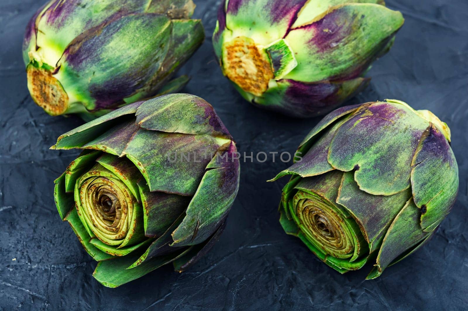 Unopened raw artichoke buds, food. Italian cuisine