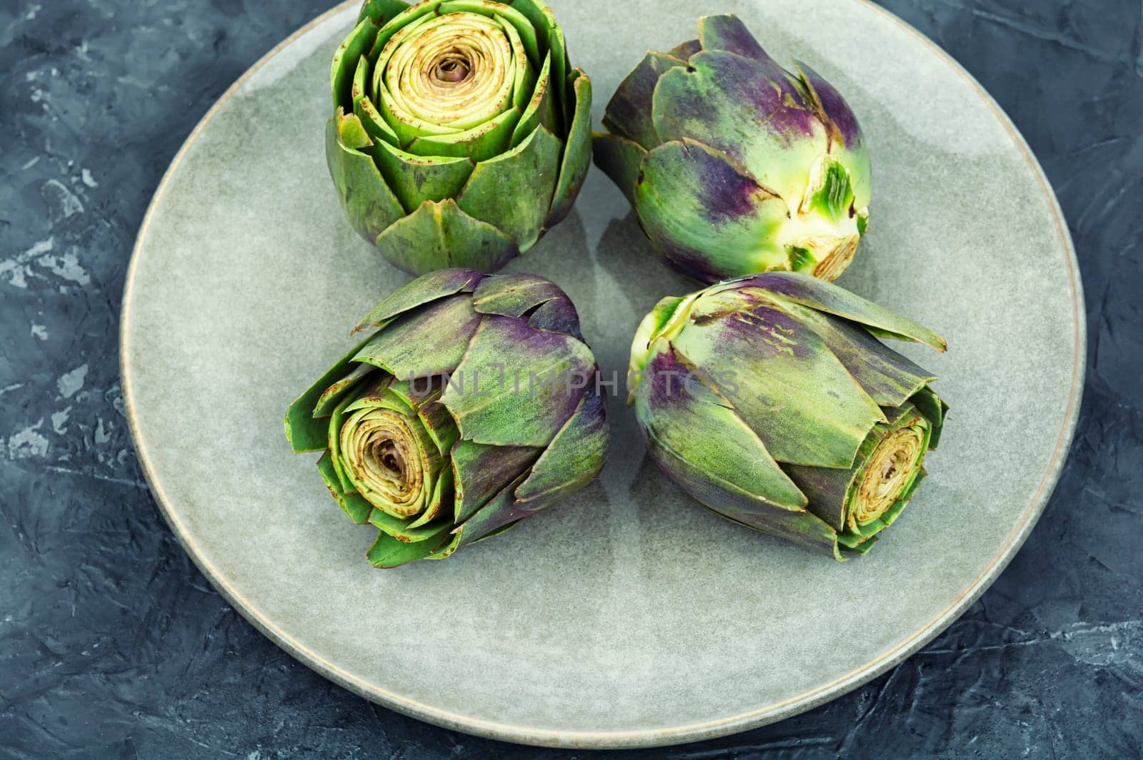 Unopened raw artichoke buds, food. Italian cuisine