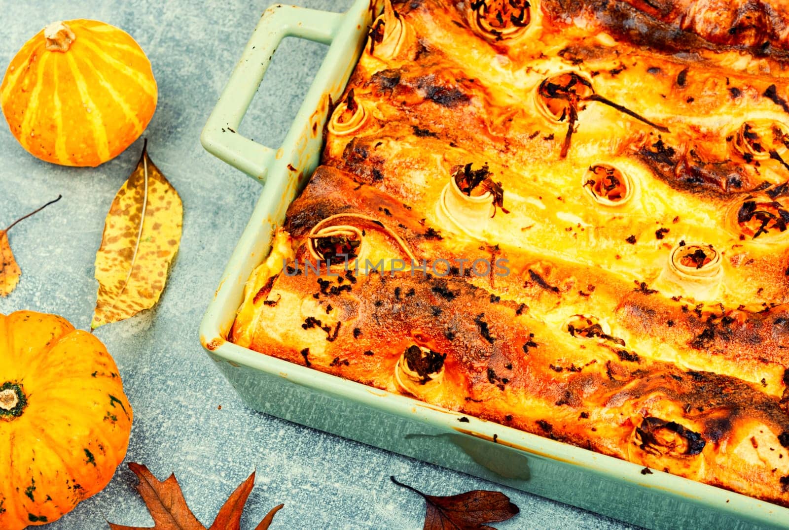 Pumpkin baked with cottage cheese in pita bread, appetizing autumn pie.