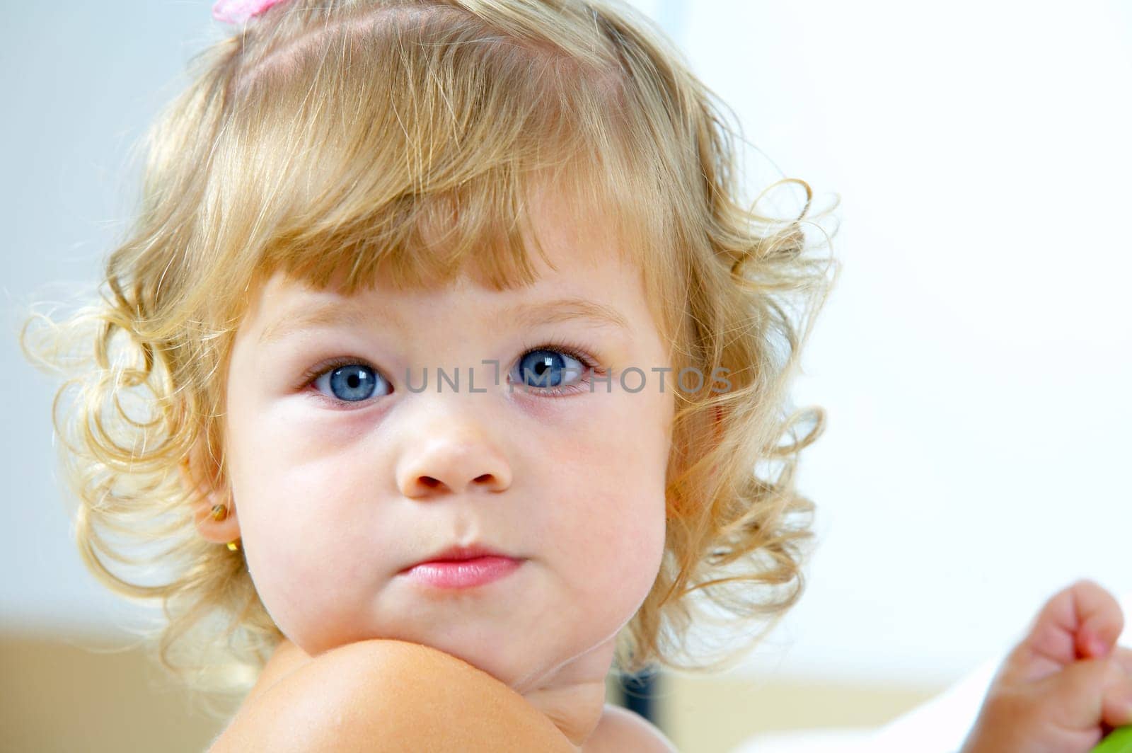 High key portrait of young blue eyed baby