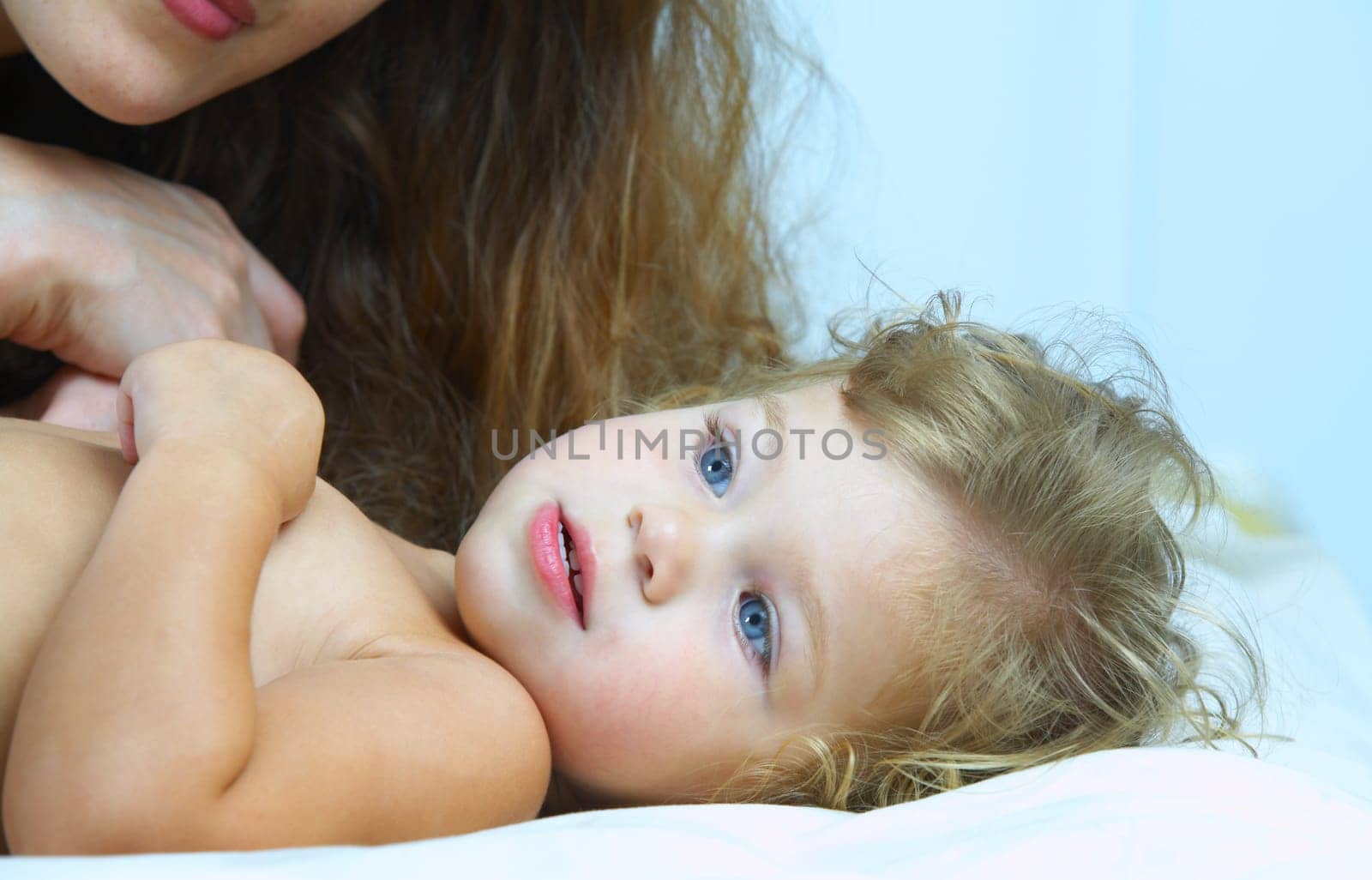 portrait of happy  young  mother with her baby